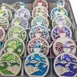 Teal satin acrylic ornament featuring a kiwi on a pohutukawa branch, ideal for festive decor and gifting.