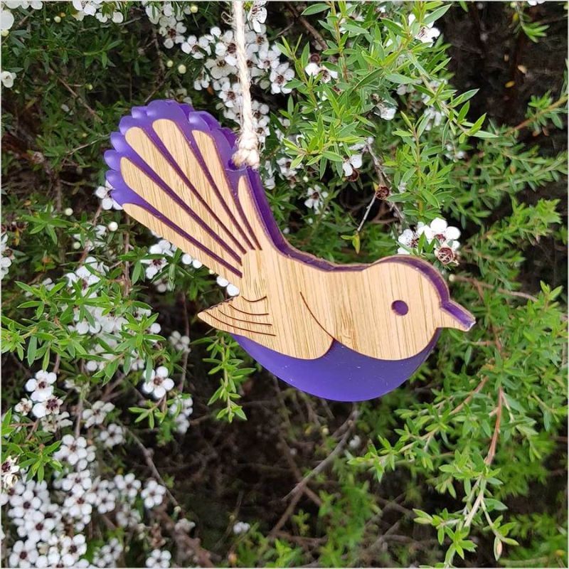 Vibrant purple satin acrylic and bamboo hanging ornament shaped like a Fantail, symbolizing joy and elegance.
