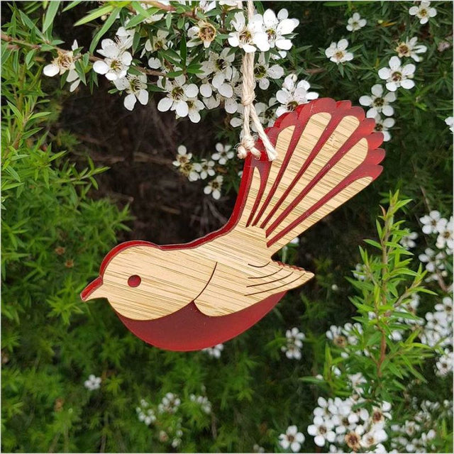 Elegant red satin-acrylic and laser-cut bamboo fantail ornament, perfect for festive decor or thoughtful gifting.