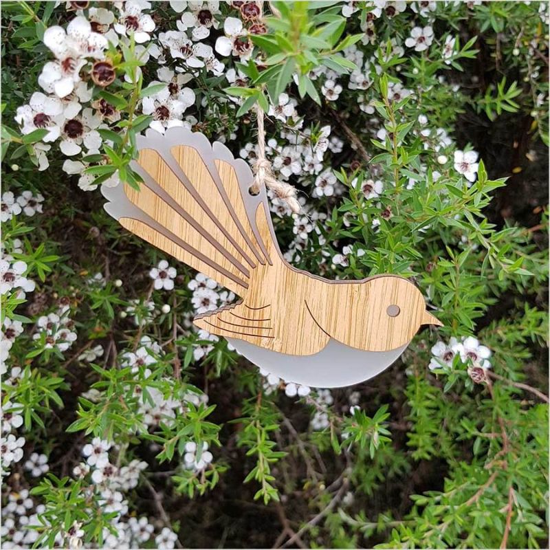 Elegant Hanging Ornament of a fantail, made from bamboo and white satin acrylic, showcasing intricate laser-cut details.