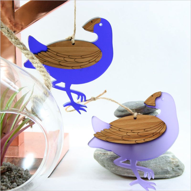 Whimsical Pukeko hanging ornament made of bamboo and purple satin acrylic, perfect for home decor or gifting.
