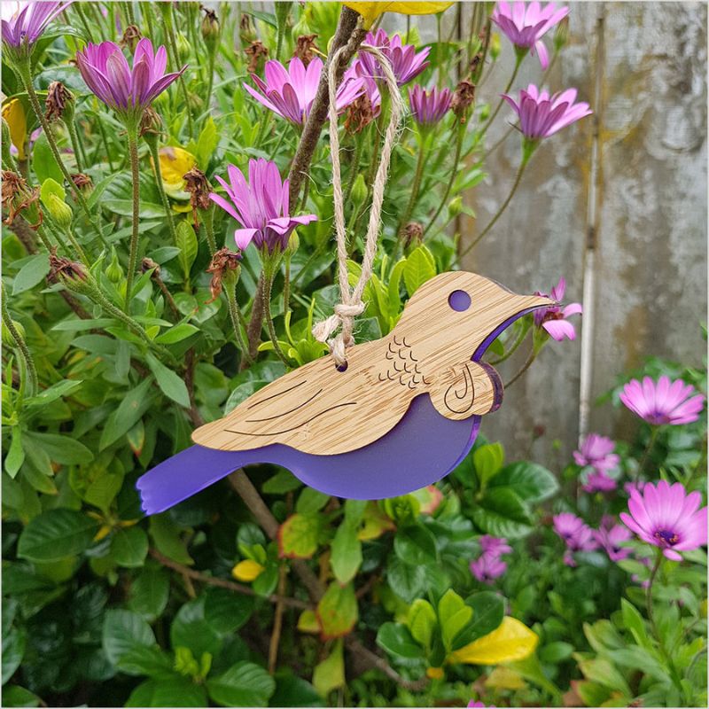 Hanging Ornament - Tui crafted from bamboo and purple satin acrylic, featuring intricate details and ready to hang.