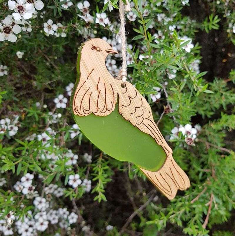 Hanging ornament featuring a laser-cut Kereru design in eco-friendly bamboo and vibrant lime green satin acrylic.