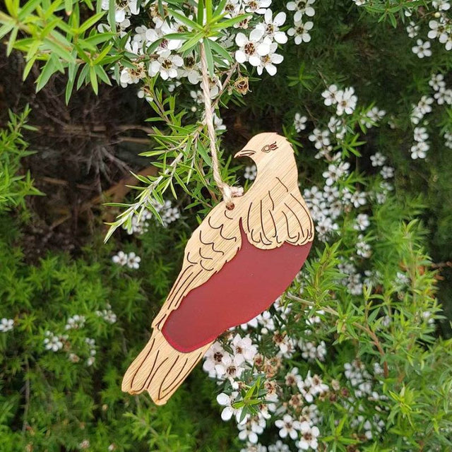 Elegant kereru hanging ornament made of bamboo and vibrant red satin acrylic, perfect for home decor and festive occasions.