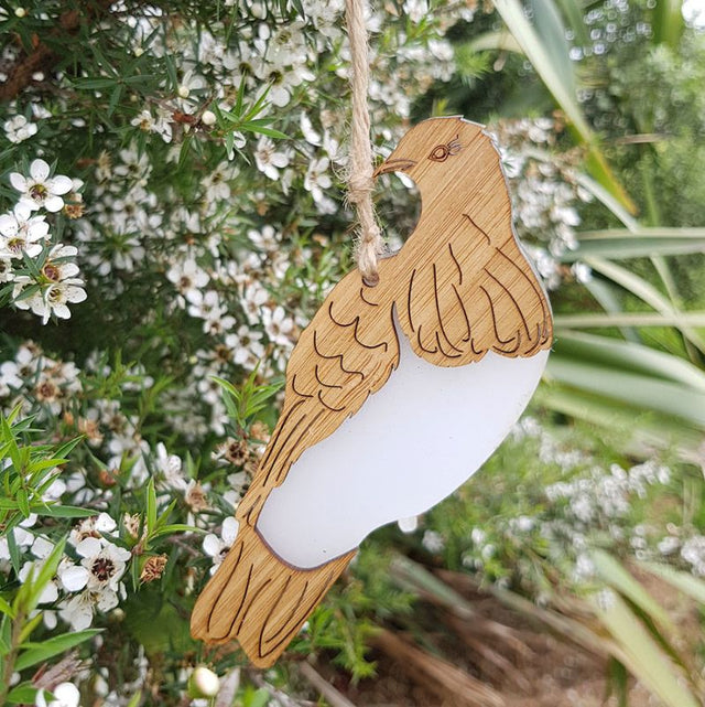 Hanging ornament of a Kereru, made from eco-friendly bamboo and white satin acrylic, perfect for home decor or gifts.
