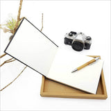 Elegant small guest book featuring laser-cut bamboo and paua, perfect for notes, sketches, or photos.