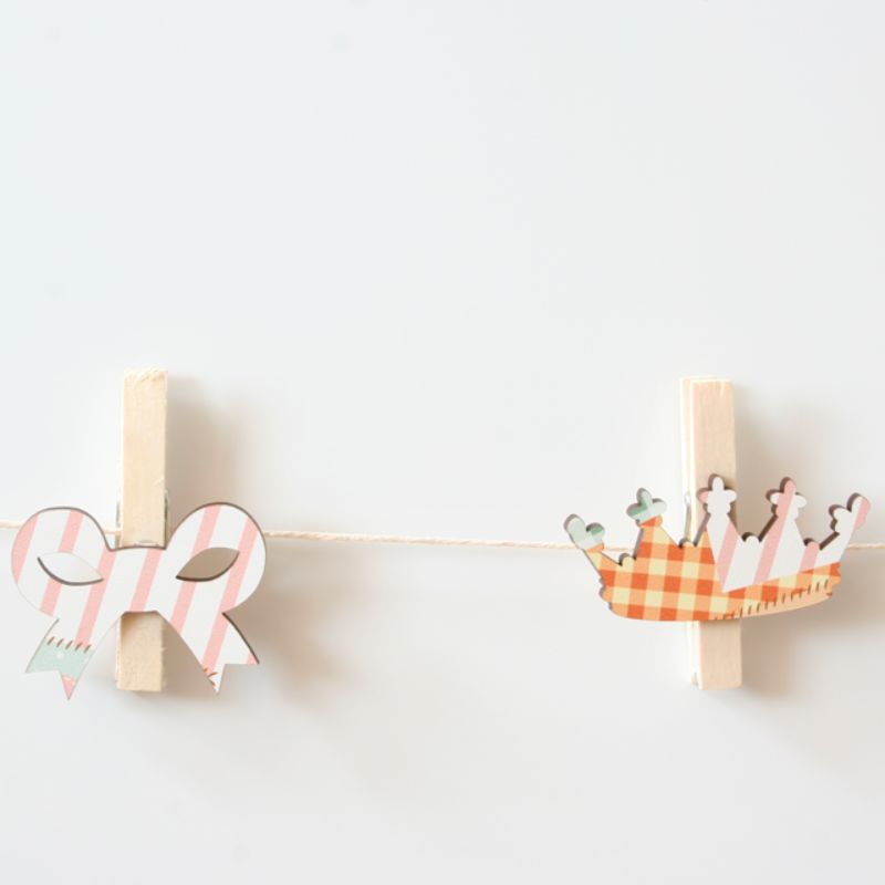 Whimsical fairy-themed pegs for hanging kids' artwork and photos, perfect for creating a magical space.