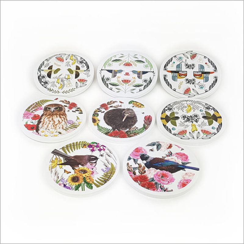 Vibrant circular wall art featuring New Zealand's Ruru and lush flora, printed on durable foam PVC, 25cm diameter.