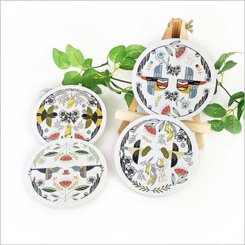 Colorful wall art featuring a folk Kereru bird, printed on durable foam PVC in a 15cm circular design. Perfect for home decor.