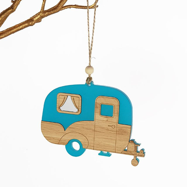 Teal satin acrylic caravan ornament featuring a laser-cut bamboo design, perfect for home decor and gifting.