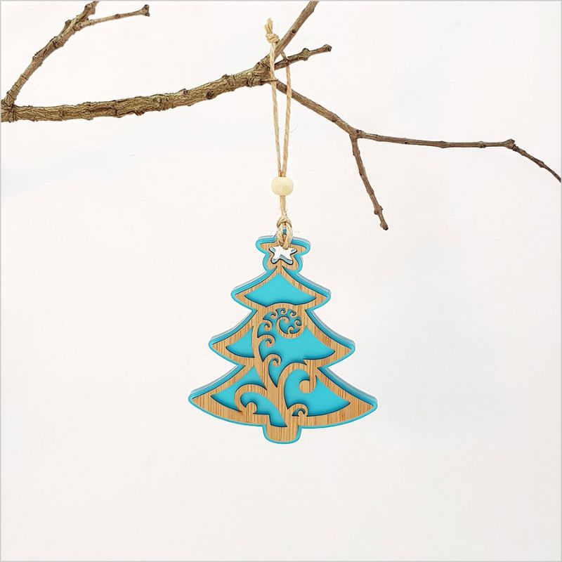 Teal Ice Acrylic Koru Xmas Tree ornament, laser-cut, eco-friendly, measuring 80mm x 110mm, perfect for holiday decor.
