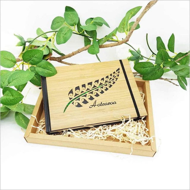 Small hardbound Aotearoa Fern Guest Book Journal featuring bamboo design and 128 acid-free pages for cherished memories.