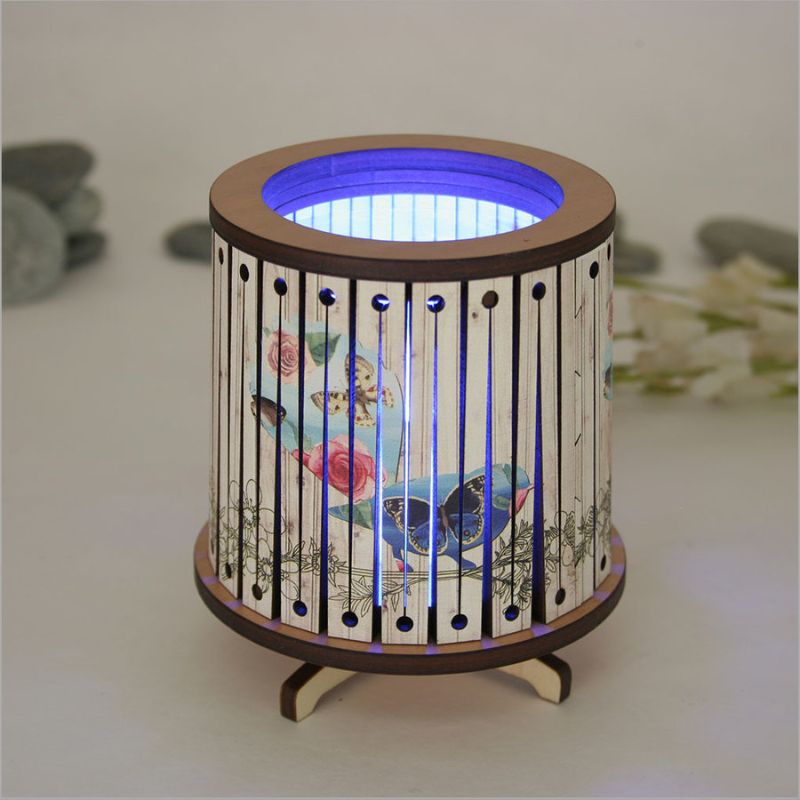 Round LED tealight holder with floral design, featuring color-changing LED candle for elegant ambiance in any space.