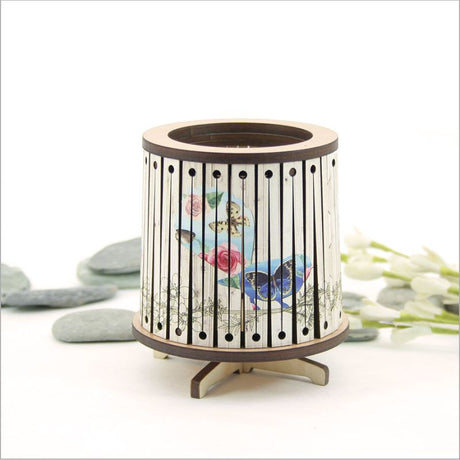 Round LED tealight holder in floral design, 85mm diameter, features color-changing LED for elegant home ambiance.