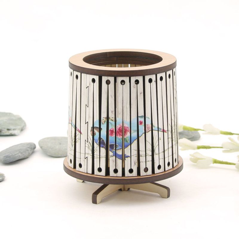 Round LED tealight holder featuring a vibrant floral kiwi design, 8.5cm, includes color-changing LED candle.