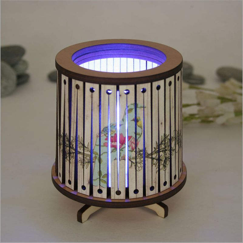 Round LED tealight holder featuring a floral Kereru design, 8.5cm wide, with color-changing LED candle for ambiance.