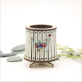 Round LED tealight holder featuring floral design, includes color-changing LED candle, perfect for home decor and ambiance.