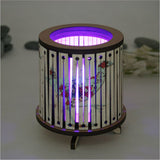 Round LED tealight holder featuring floral design and color-changing LED, perfect for home decor and cozy atmospheres.