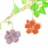 Purple satin acrylic hanging ornament in hibiscus design, featuring intricate laser cut details and ready to hang.