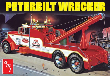 Alt text: "1/25 scale model kit of Peterbilt 359 Wrecker by AMT, unassembled with detailed components for hobbyists."