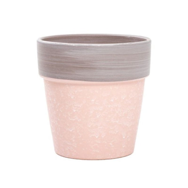 Ceramic terracotta pot in soft pink, measuring 14x13.5cmH, perfect for showcasing indoor plants and floral arrangements.
