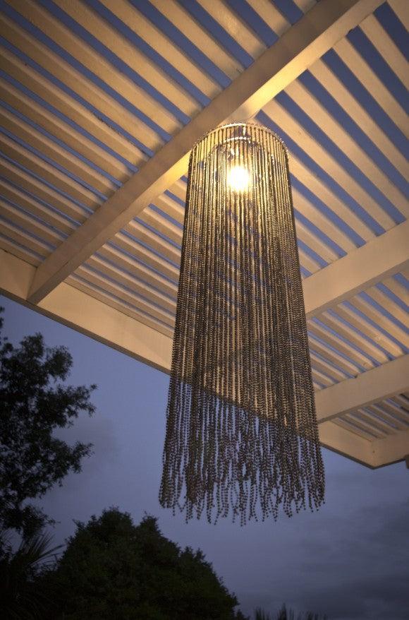 Long black beaded chandelier featuring a stylish cylindrical design, perfect for elegant ambient lighting in any room.