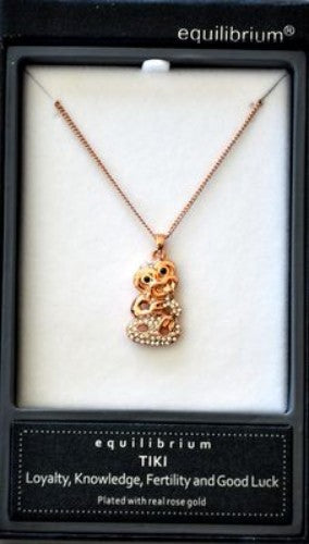 Rose gold plated tiki necklace featuring Maori motifs, symbolizing strength and protection in a contemporary design.