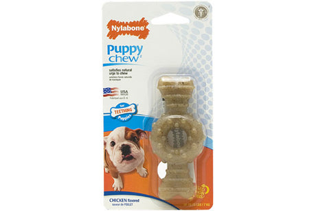 Chew toy for teething puppies, made of soft polymer, with raised bristles for dental hygiene and chicken flavor.