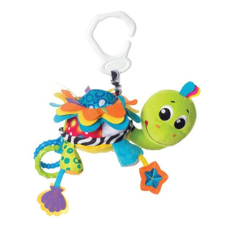 Colorful Flip the Turtle baby activity toy with rattle sounds, mirror, and textured rings for sensory play and developmental growth.