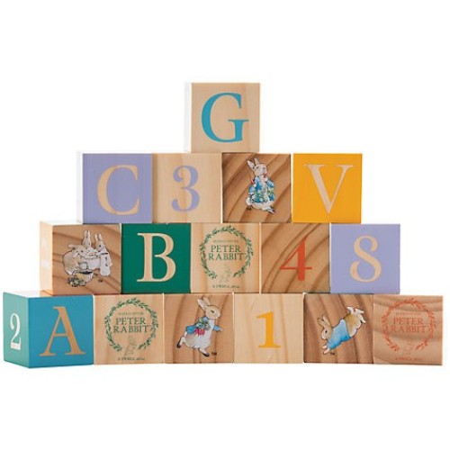Colorful wooden picture blocks featuring Beatrix Potter's Peter Rabbit and friends, perfect for toddlers' play and nursery decor.