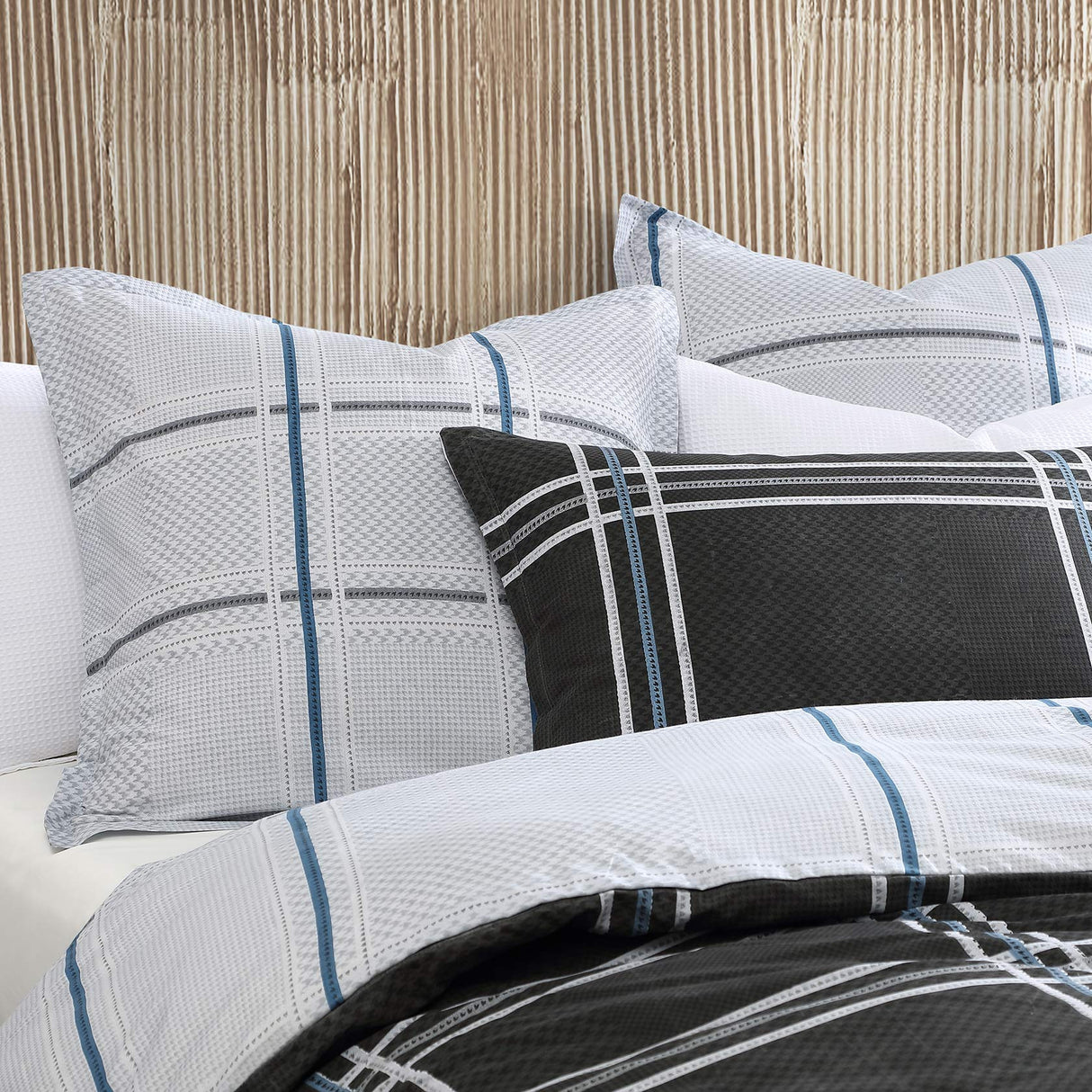 Luxurious Charlie Black European Pillowcase by Logan and Mason, featuring reversible design, premium fabric, and trendy colors.