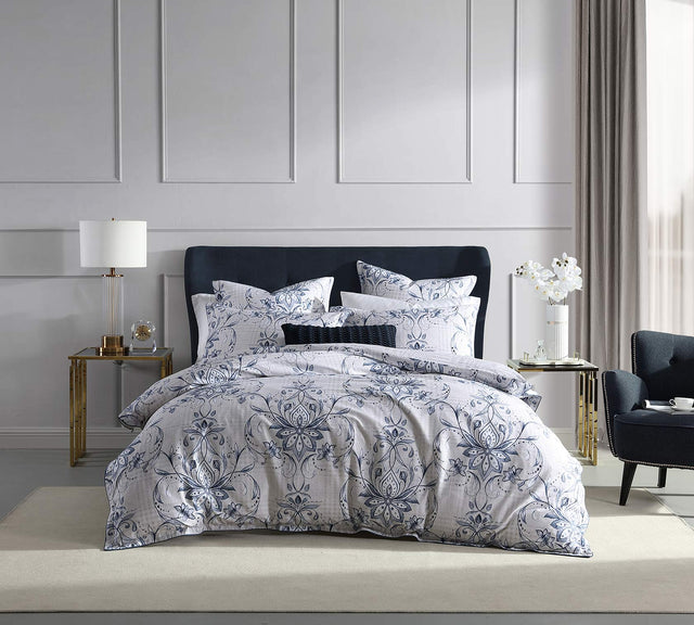 Super King Duvet Cover set featuring a damask motif in white, navy, and linen with houndstooth check reverse and blue piping.