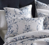 Super King duvet cover set featuring a damask motif in crisp white, navy, and linen, with houndstooth reverse and blue piping.