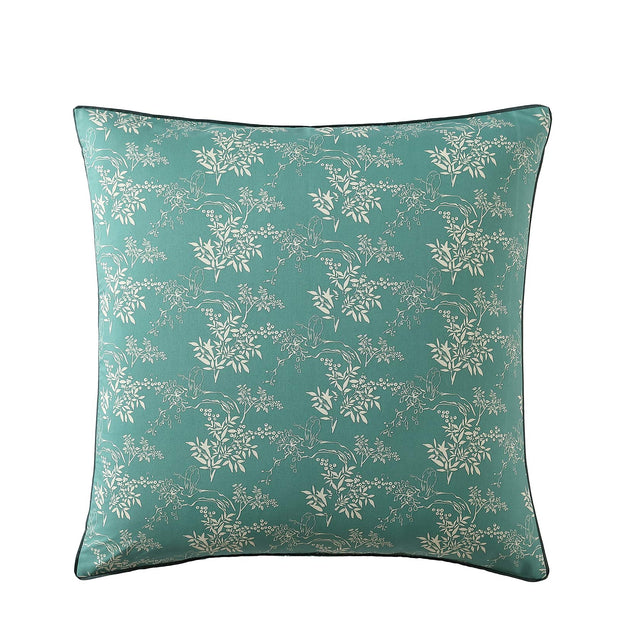 Frolic Jade European Pillowcase featuring vibrant blooms, hummingbirds, and deep jade piping for an exotic touch.