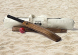 Vintage-inspired backyard cricket set with wooden bat, wickets, ball, and carry bag for outdoor fun.