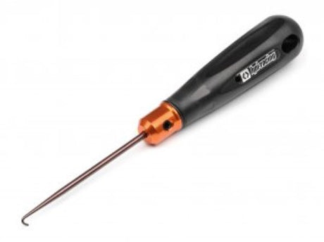 High-performance exhaust spring remover with orange-anodized accents and ergonomic handle, designed for RC hobbyists.