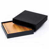 Elegant Clamshell Cheese Board made of Acacia hardwood with stainless steel utensils, perfect for serving cheese at gatherings.