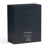 Jewel-toned Festa Wine Glass Set, 4 stemless glasses in jade, gold, purple, and emerald, presented in a sleek box.