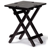 Foldable bamboo table with wine glass holders, ideal for outdoor dining and easy transportation in a carry bag.