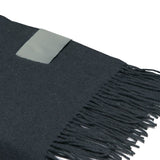 Luxury Merino wool blanket throw with herringbone weave, soft finish, and stylish fringes, perfect for cozy decor.