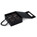 Elegant Quartetto Espresso Set featuring four matte black ceramic cups designed for exquisite coffee moments.