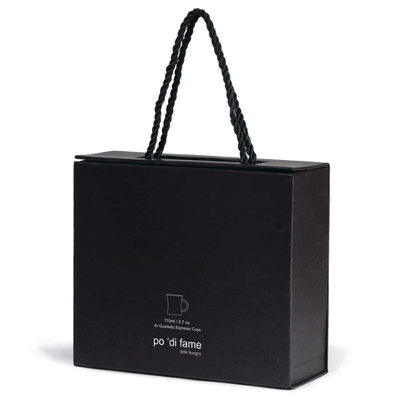 Elegant quartetto espresso set featuring four matte black ceramic cups, perfect for rich espresso or mini desserts.