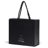 Elegant quartetto espresso set featuring four matte black ceramic cups, perfect for rich espresso or mini desserts.