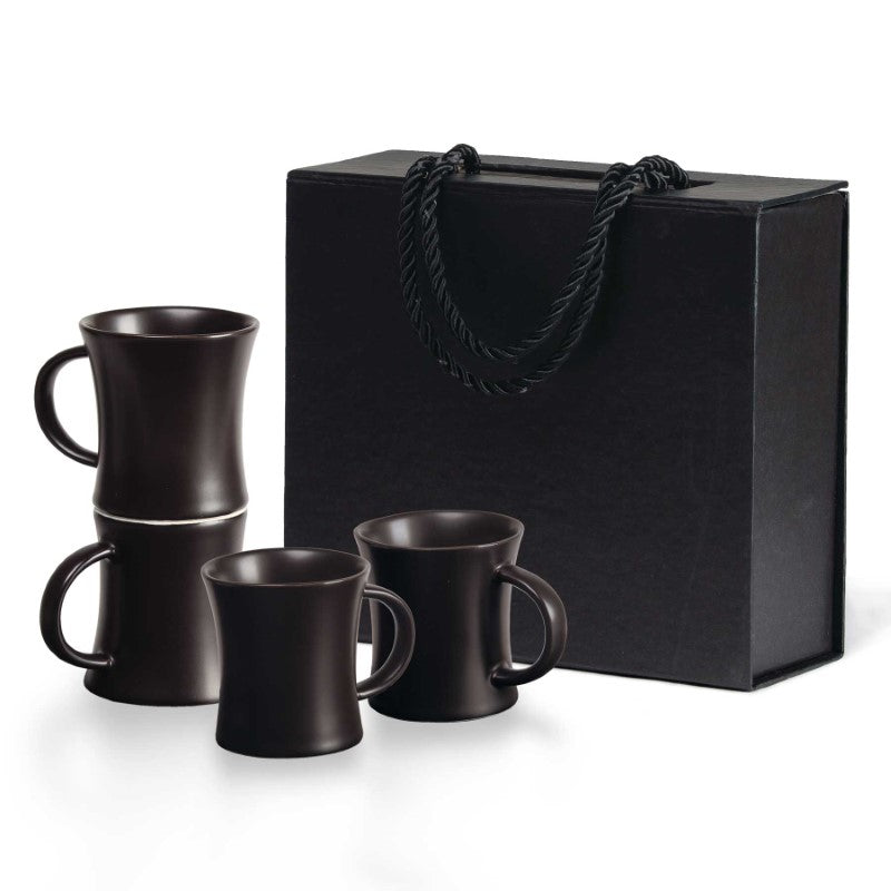 Elegant Quartetto Espresso Set featuring four matte black ceramic cups with a European demitasse design, perfect for espresso.