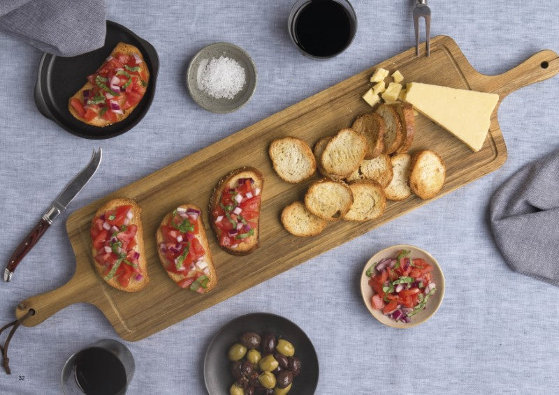 Elegant Acacia hardwood tapas serving board with dual handles, juice rim, unique grain, and luxurious presentation box.