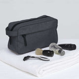 Stylish smpli Wetpac Wash Kit in black and white, featuring spacious compartments and a durable design for travel grooming essentials.