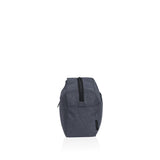 Stylish black and white striped wash kit made from durable polyester, featuring zip pockets and organized mesh compartments.