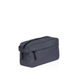Stylish smpli Wetpac Wash Kit in black and white, featuring durable material and organized compartments for travel grooming essentials.