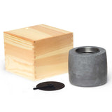 Ambi Flame Pit in cement with black snuff plate, removable canister, and packaged in an elegant pine box.