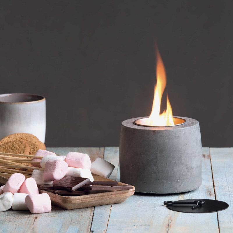 Ambi Flame Pit: sleek cement design with stainless steel canisters, perfect for indoor and outdoor ambience.